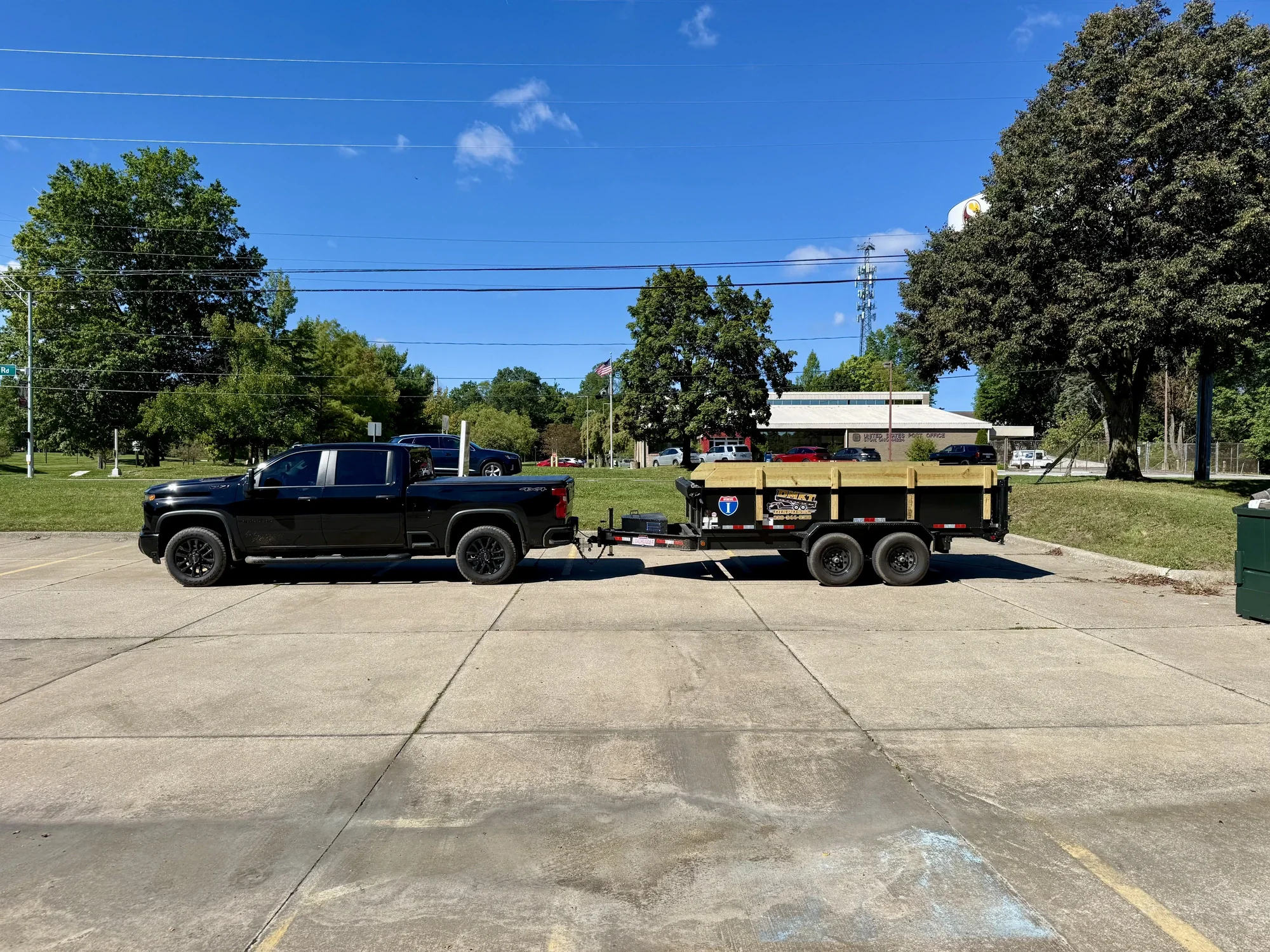DMKT Disposal truck and dump trailer on a sunny day in Northeast Ohio
