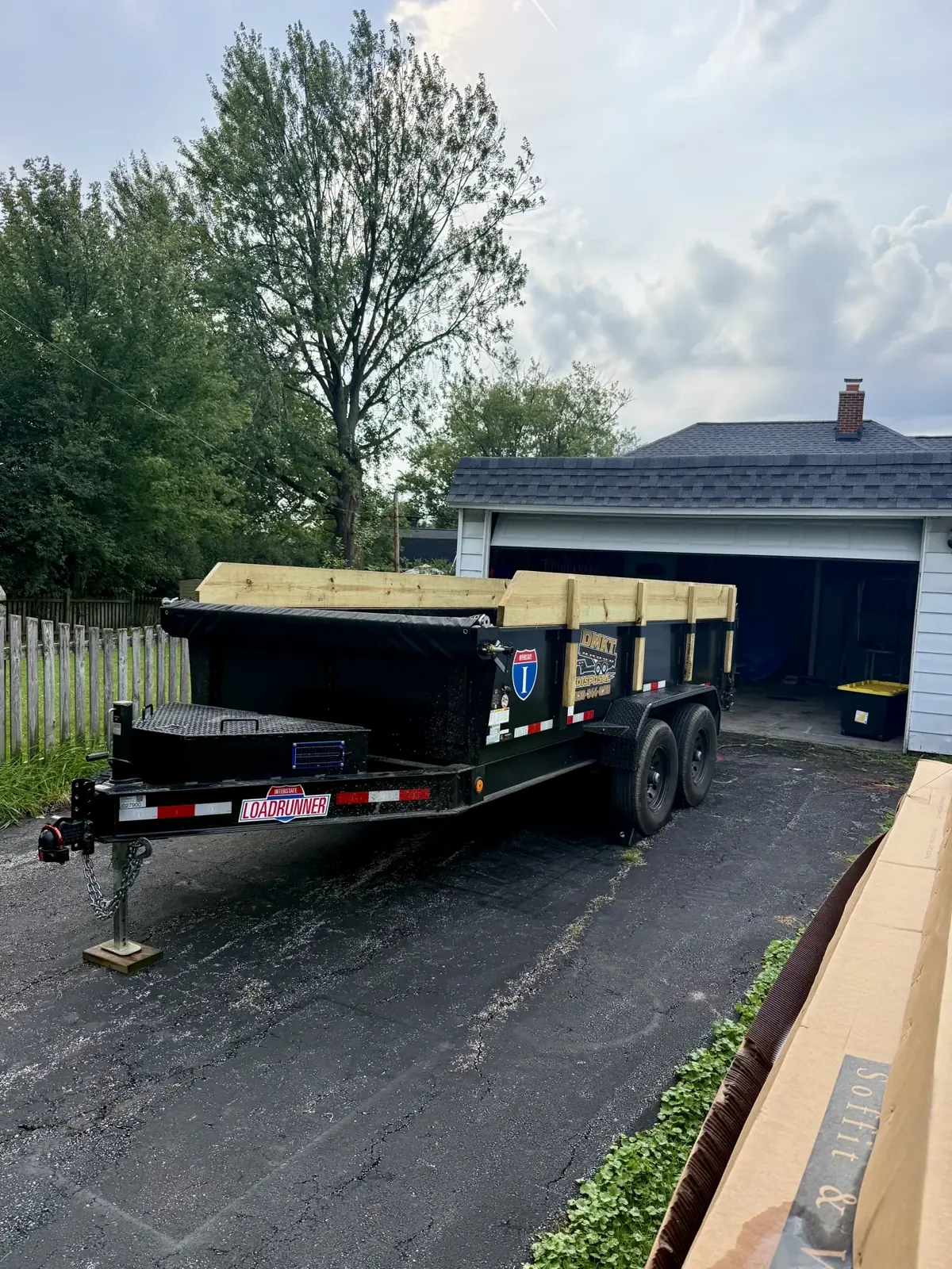 DMKT Disposal dump trailer delivered to a residential driveway in Northeast Ohio